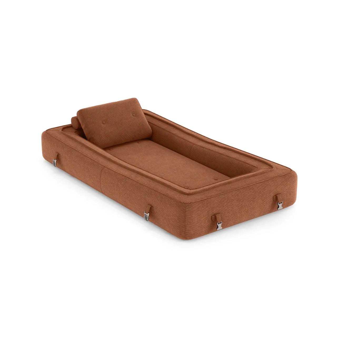 Flippo Sofa Bed in Chestnut color – rich warm tone, sculptural design, soft corduroy fabric, convertible to bed, modern statement furniture